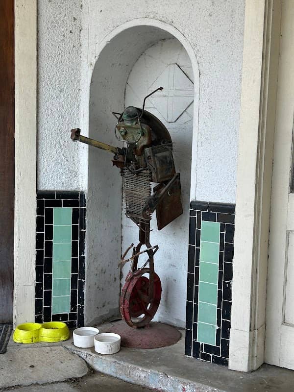 Catfish Riding a Unicycle Sculpture - Image 1