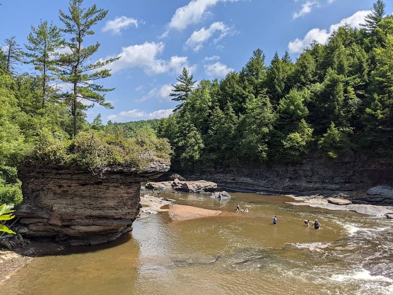 Riverside Rock Overhang - Image 1