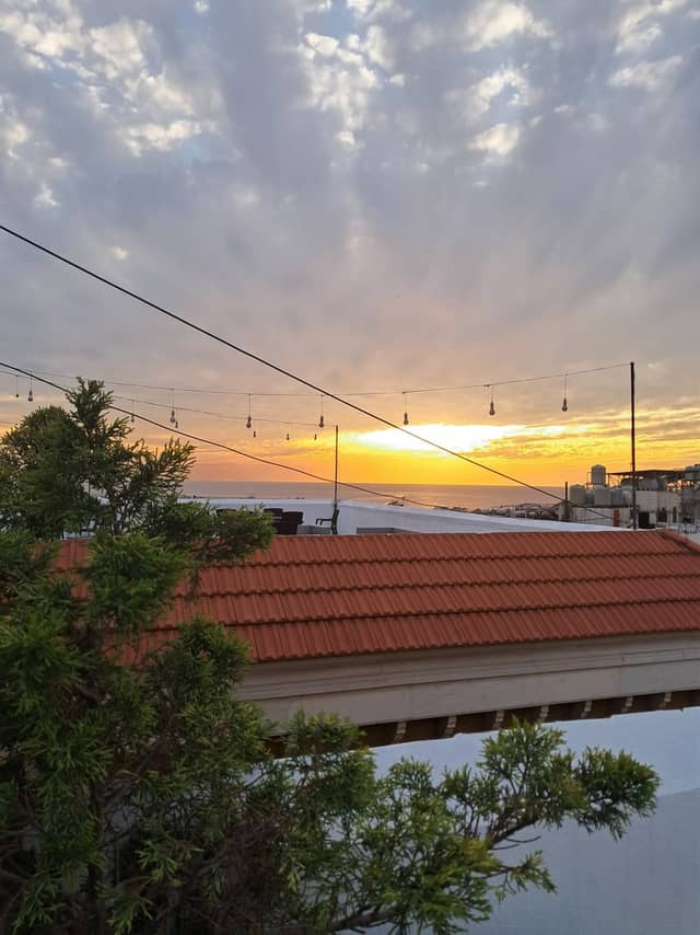 Al Mazraa Rooftop Sunset View - Image 1