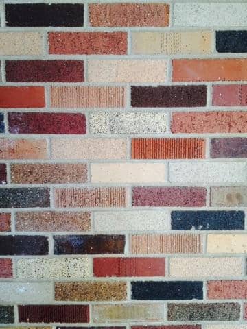 Textured Brick Wall on Main Street - Image 1