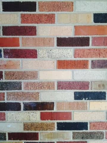 Textured Brick Wall on Main Street - Image 1