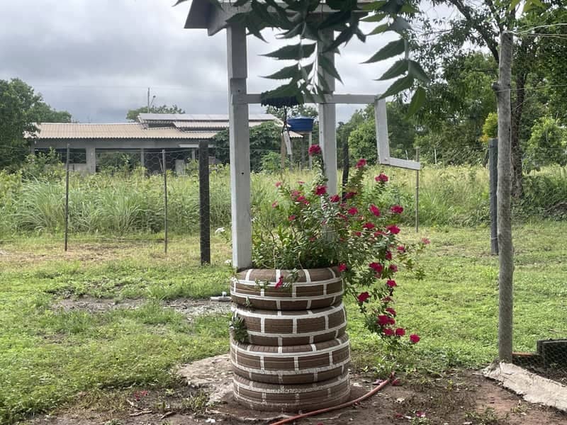 Rustic Tire Garden Well - Image 1