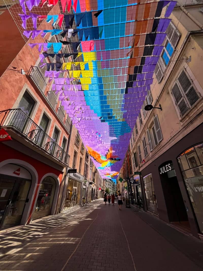 Vibrant Flag Canopy Pedestrian Street - Image 1