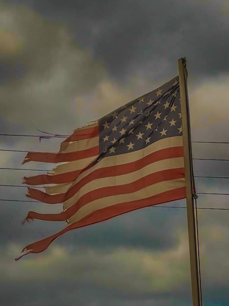 Tattered Flag Over Accra - Image 1