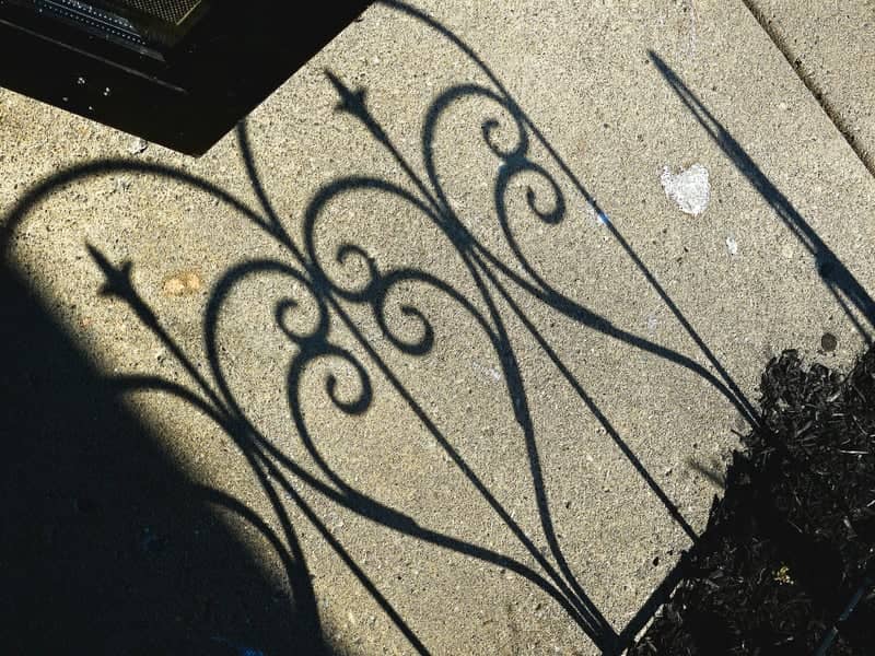 Ornate Gate Shadows - Image 1