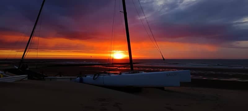 Coastal Catamaran Sunset - Image 1
