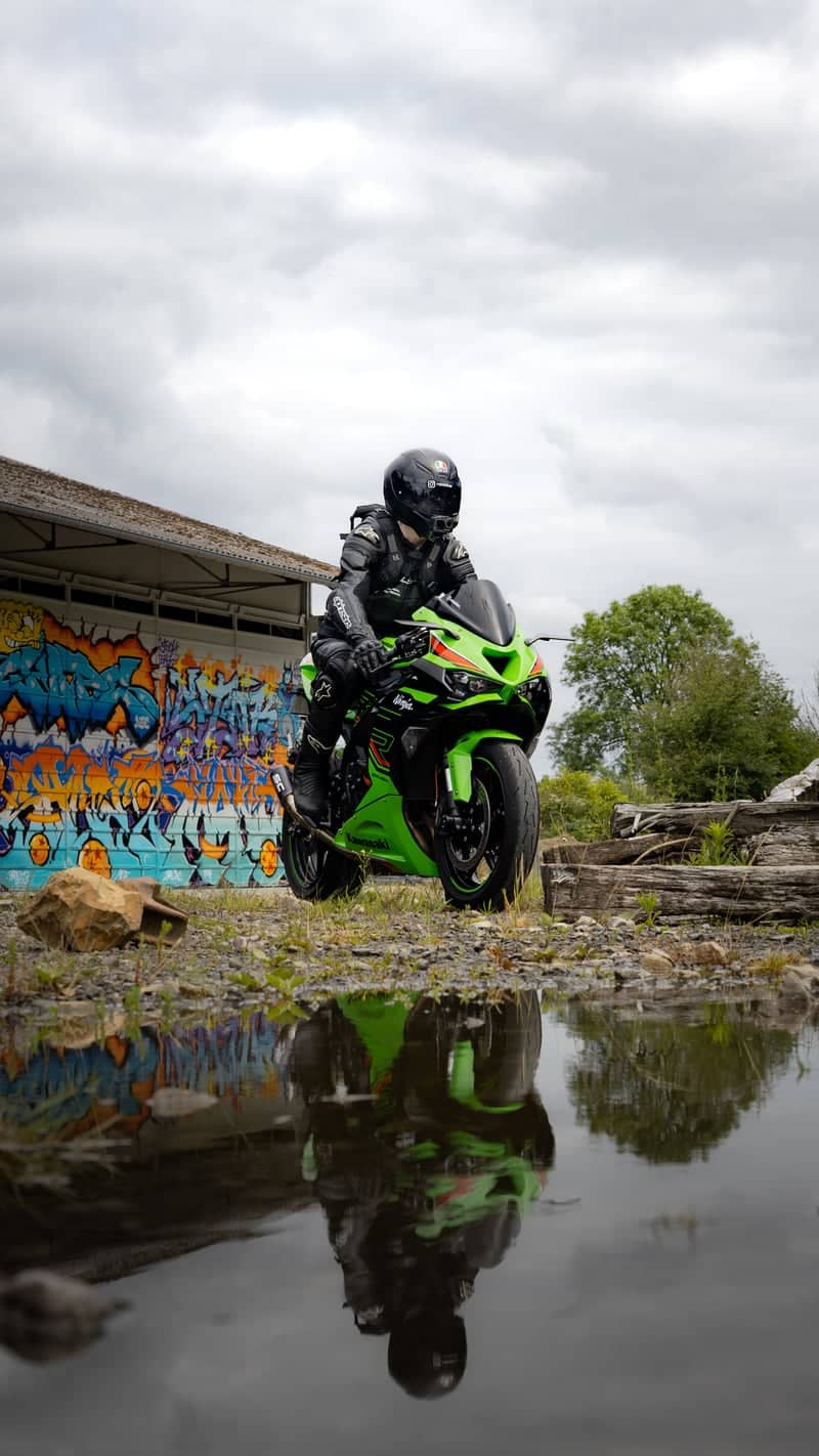 Graffiti Wall and Puddle Reflection, Villedieu-les-Poêles - Image 1