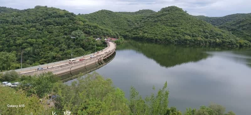 Scenic Curved Dam and Reservoir Overlook - Image 1